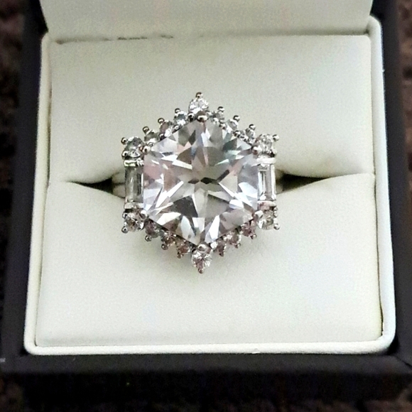 White Topaz Halo Ring In Platinum Over 925 Sterling Silver.